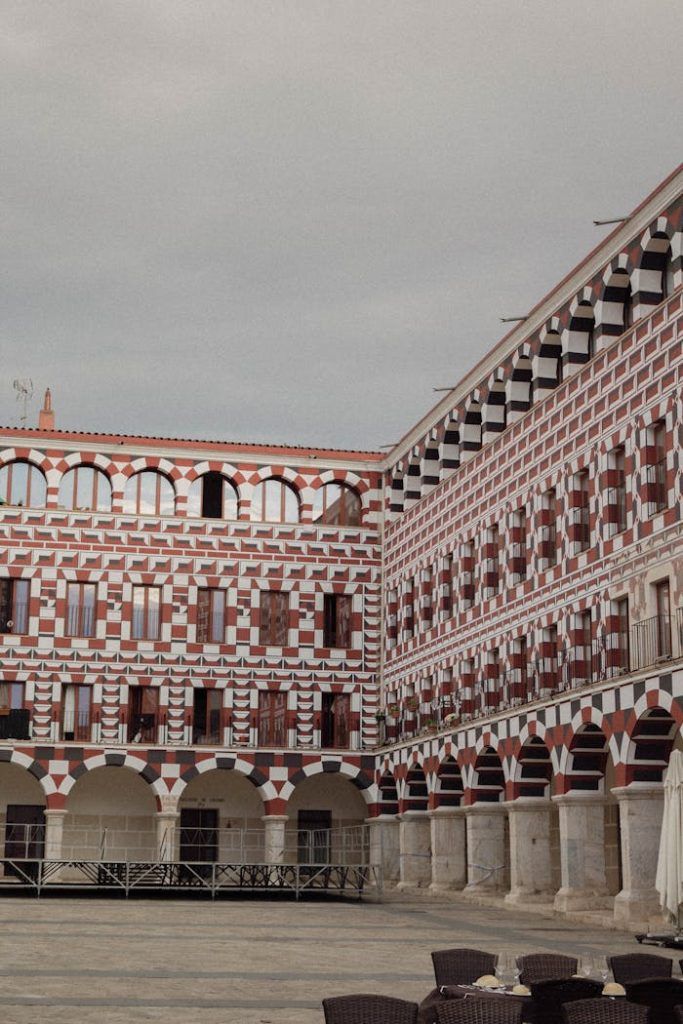 Explore the ornate architecture of an historic courtyard in Badajoz, Spains old town.