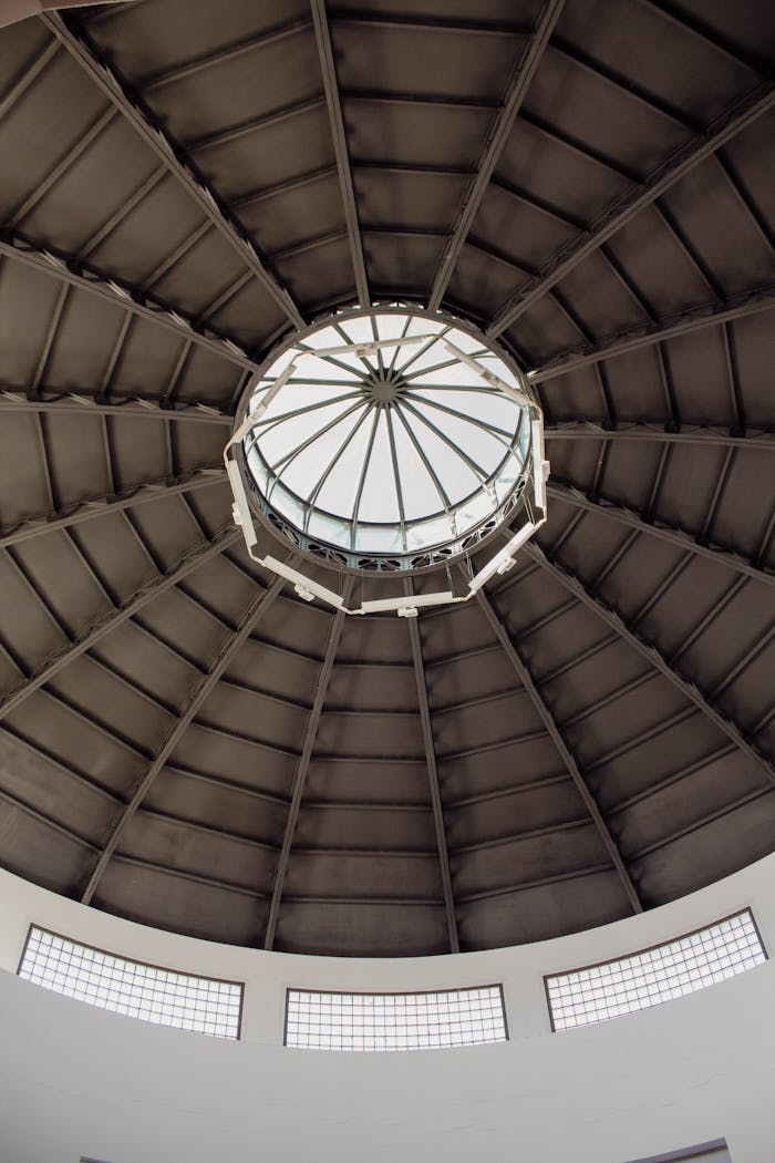 View of a circular modern dome ceiling in Badajoz, Spain, showcasing geometric architectural design.